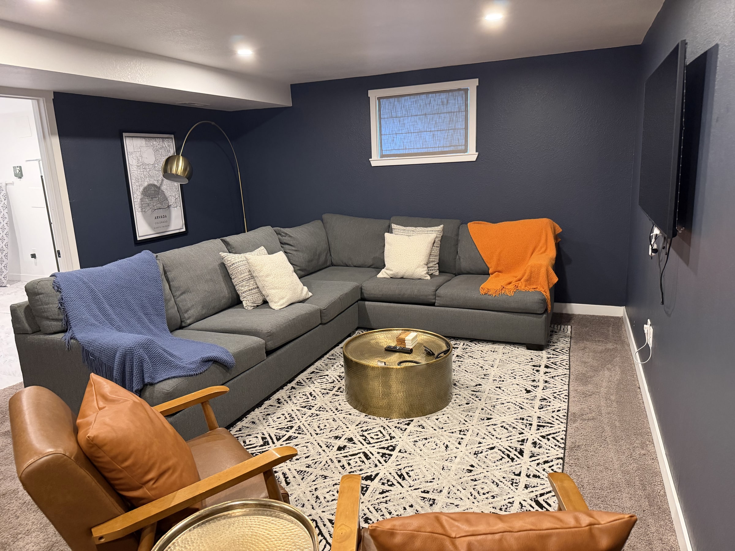 Comfortable lounge with sectional seating and clean carpet
