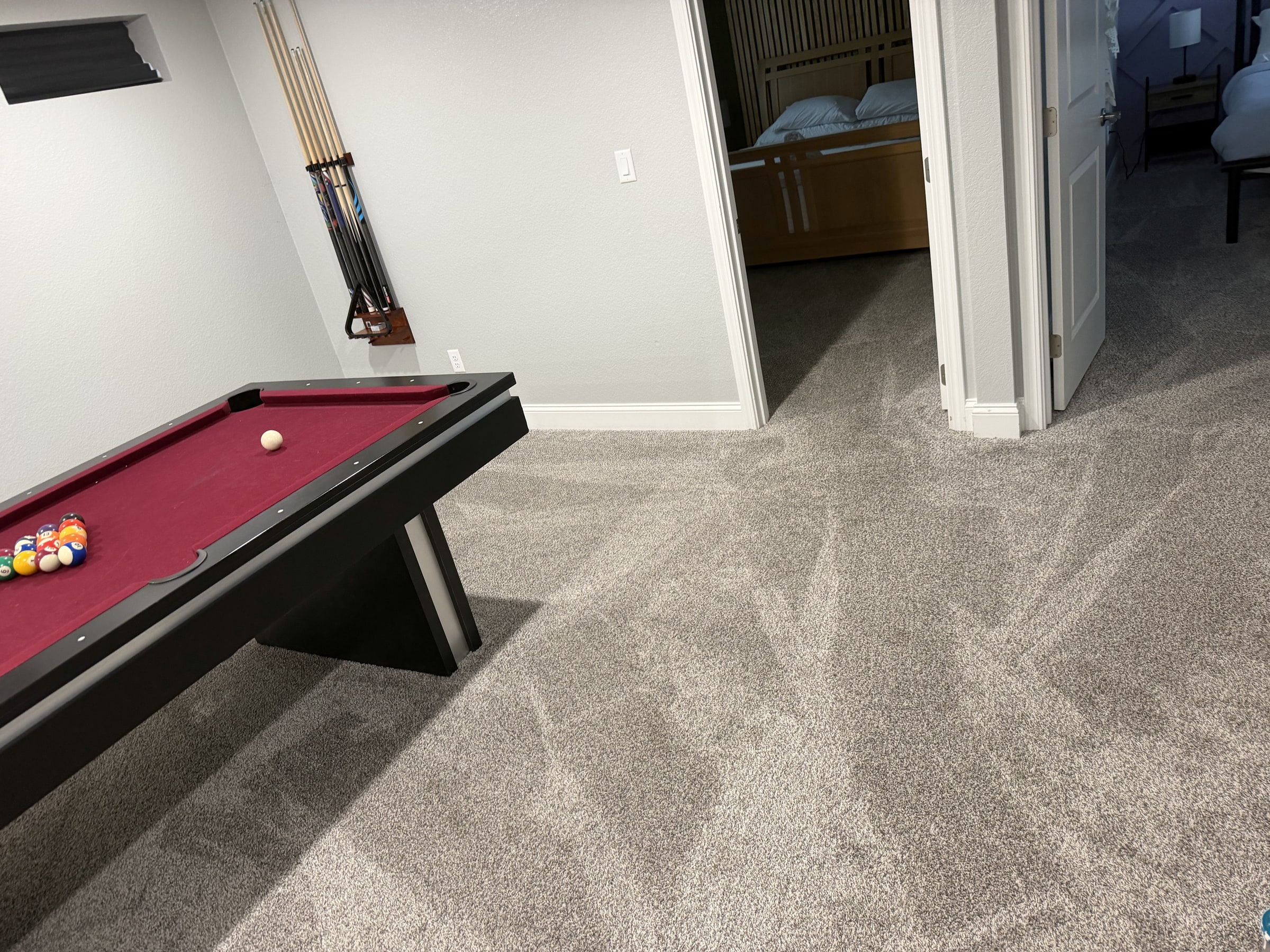 Game room with pool table and freshly cleaned carpet